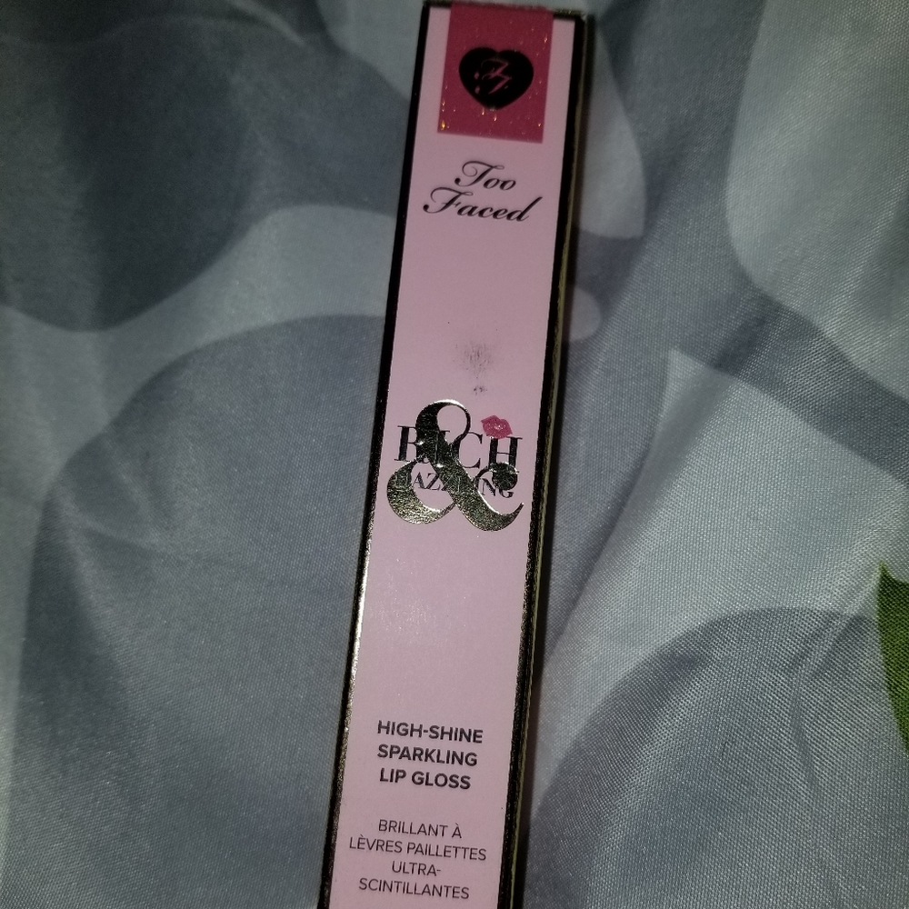 Too faced lip gloss in crazy rich